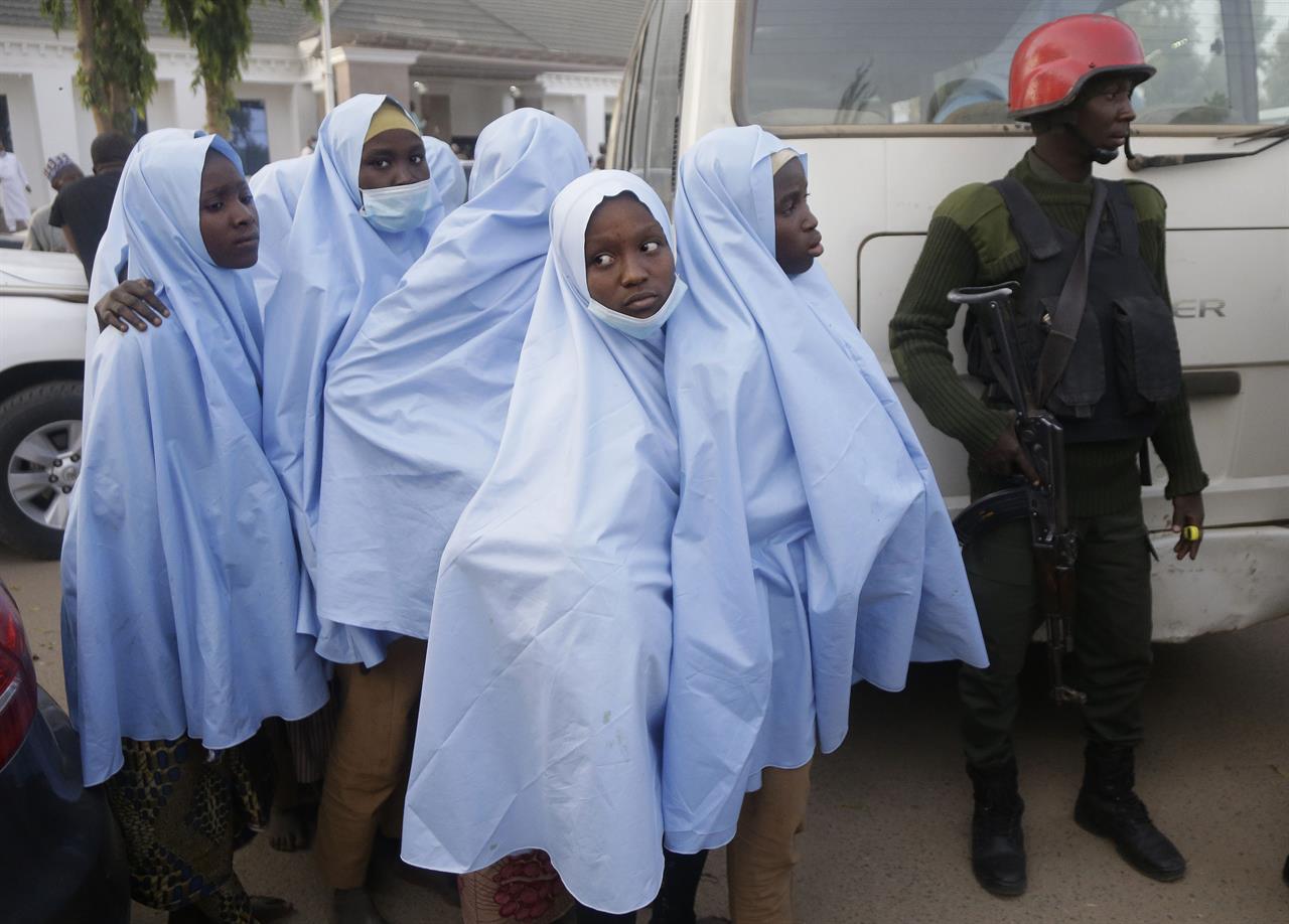 Some of the Government Girls Secondary School students who were abducted by gunmen the previous week in Jangebe, Nigeria, wait for a medical checkup after a meeting with Zamfara state Gov. Bello Matawalle, in Gusau, northern Nigeria, on Tuesday, March 2, 2021. Matawalle announced that 279 girls who were abducted from the boarding school in the northwestern part of the state have been released. (AP Photo/Sunday Alamba)