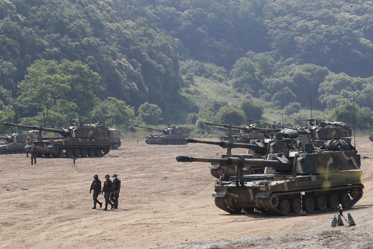 South Korean army K-9 self-propelled howitzers take positions during the annual exercise in Paju, South Korea, near the border with North Korea, Tuesday, June 23, 2020. A South Korean activist said Tuesday hundreds of thousands of leaflets had been launched by balloon across the border with North Korea overnight, after the North repeatedly warned it would retaliate against such actions. (AP Photo/Ahn Young-joon)