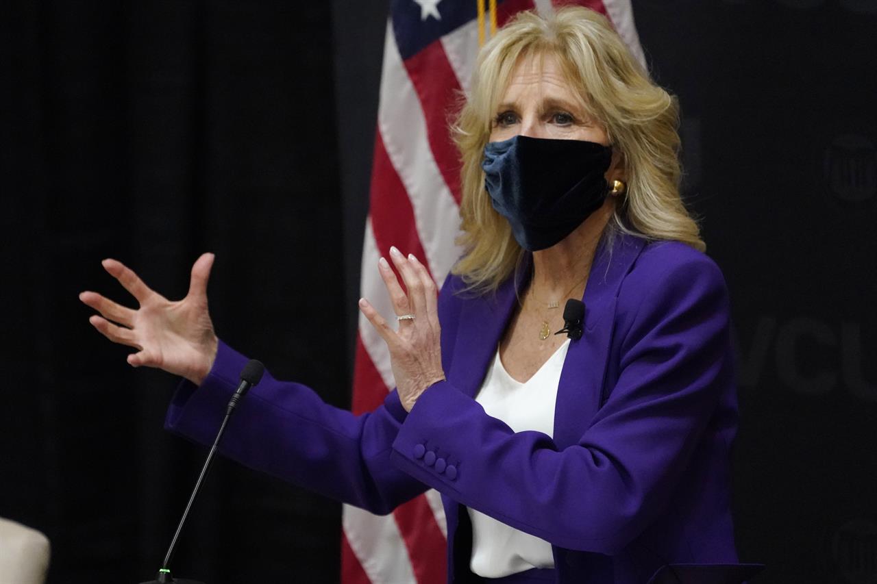 FILE - In this Wednesday, Feb. 24, 2021, file photo, first lady Jill Biden speaks during a visit to the Massey Cancer Center at Virginia Commonwealth University for a discussion about cancer disparities, in Richmond, Va. Biden says nearly two dozen women the State Department is honoring, Monday, March 8, 2021, for their courage, made an “intentional decision” to persist and demand justice despite their fear. (AP Photo/Steve Helber, File)