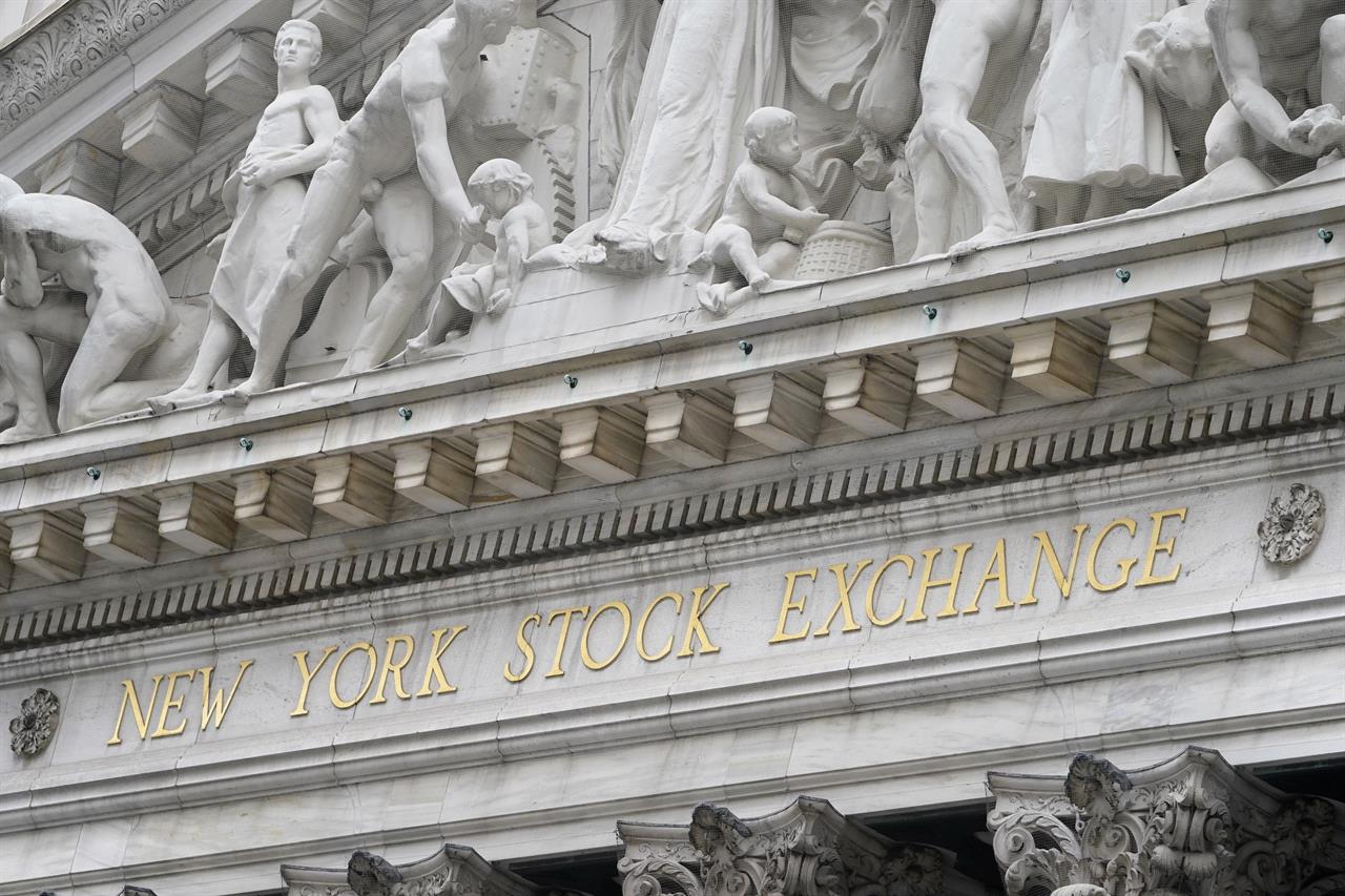 FILE - In this Nov. 23, 2020 file photo, stone sculptures adorn the New York Stock Exchange. Stocks are opening higher on Wall Street, Thursday, April 1, 2021 led by more gains in technology giants and smaller companies. (AP Photo/Seth Wenig, File)