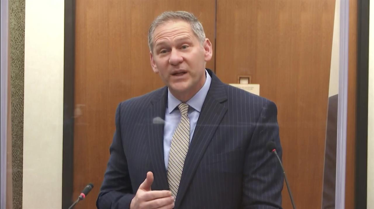 In this image from video, prosecutor Steve Schleicher questions witness Los Angeles police department Sergeant Jody Stiger, as Hennepin County Judge Peter Cahill presides Wednesday, April 7, 2021, in the trial of former Minneapolis police Officer Derek Chauvin at the Hennepin County Courthouse in Minneapolis. Chauvin is charged in the May 25, 2020 death of George Floyd. (Court TV via AP, Pool)