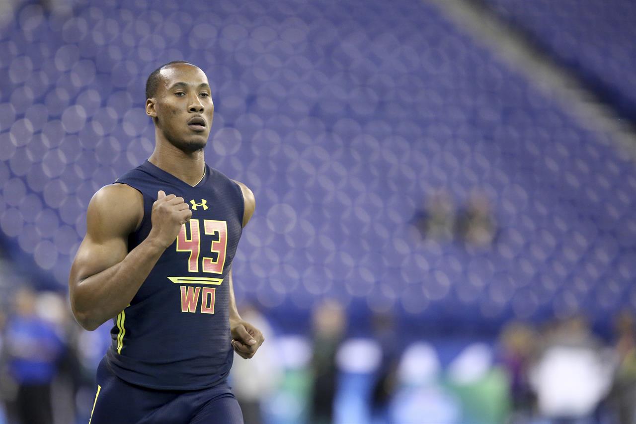 FILE - Florida State wide receiver Travis Rudolph runs a drill at the 2017 NFL football scouting combine in Indianapolis, in this Saturday, March 4, 2017, file photo. Former Florida State star football player Travis Rudolph was arrested early Wednesday, morning, April 7, 2021, in South Florida for a shooting that left one man dead and another wounded, authorities said. Rudolph, 25, was charged with first-degree murder and attempted first-degree murder, according to a Palm Beach County Sheriff's Office news release. (AP Photo/Gregory Payan, File)